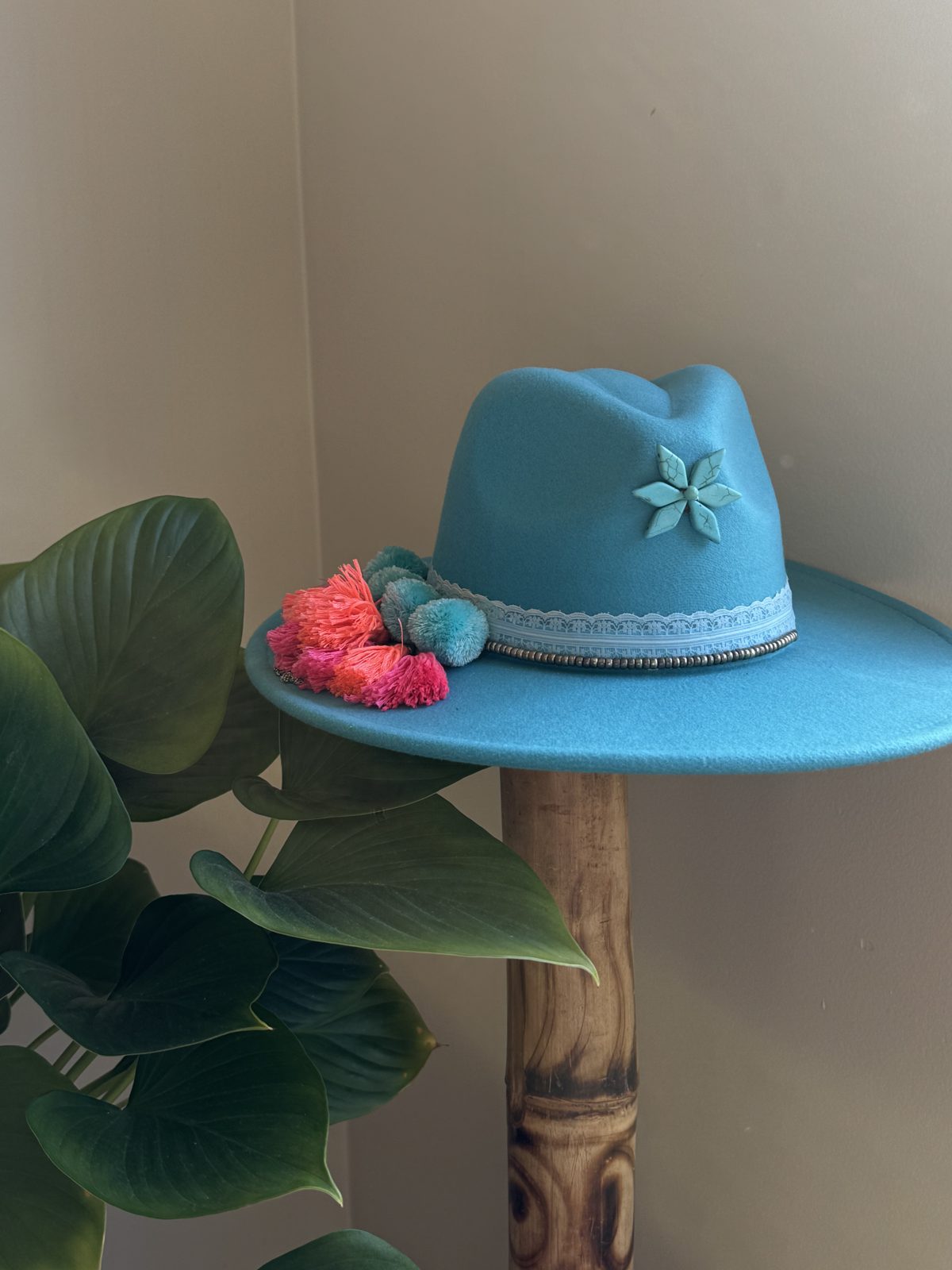 Sky blue fedora with flower and coral pompom