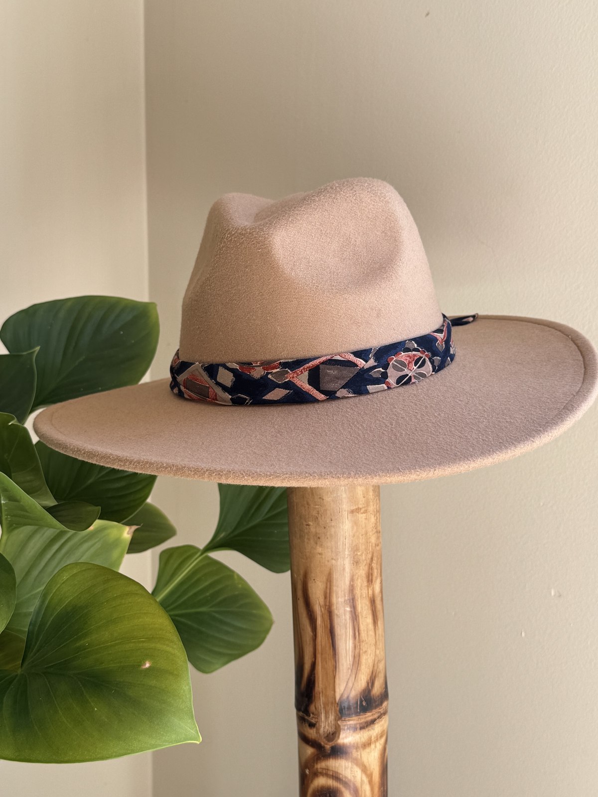 Taupe fedora with navy paisley scarf band