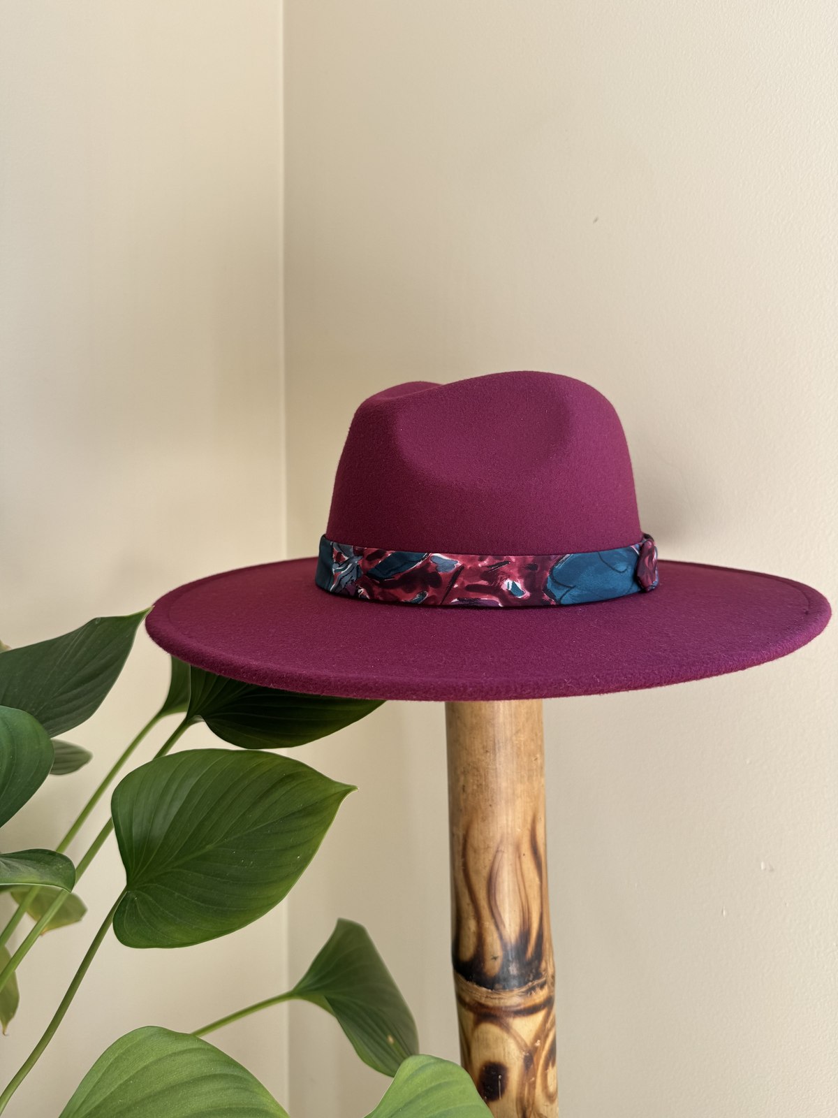 Magenta fedora with marbled blue and wine scarf band