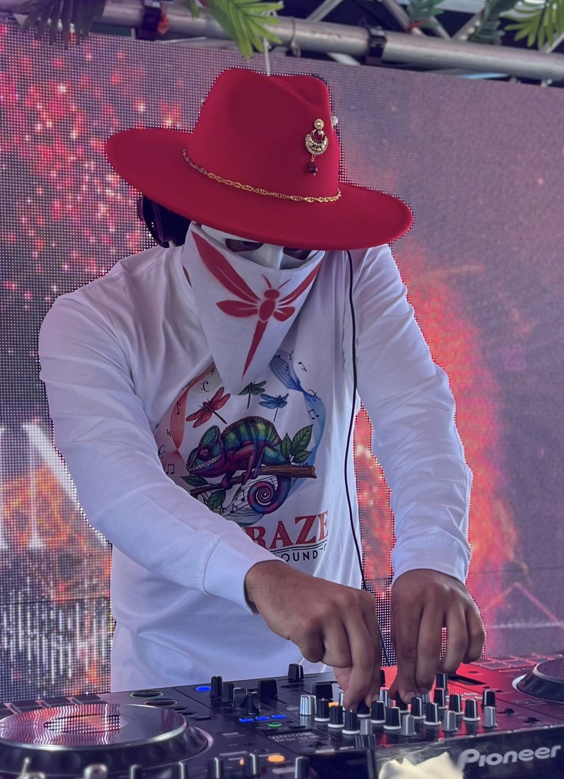 DJ wearing red JHATS_CO fedora on stage